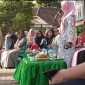 Kepala Sekolah SMA Negeri 9, Linda Krisnawati memberikan sambutan dalam Peringatan Maulid Nabi Muhammad SAW Tahun 1445 H.   Foto: Ferry HT, Kabar Indonesia