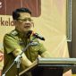 M. Firsada, Pj. Bupati Tulang Bawang Barat memberikan sambutan dalam rangka peringatan Hari Ibu Tahun 2024. Foto: Andi Rahman, Kabar Indonesia
